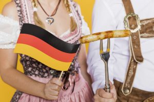 young man and woman german flag and grilled sausage Hoteles en Andalucia